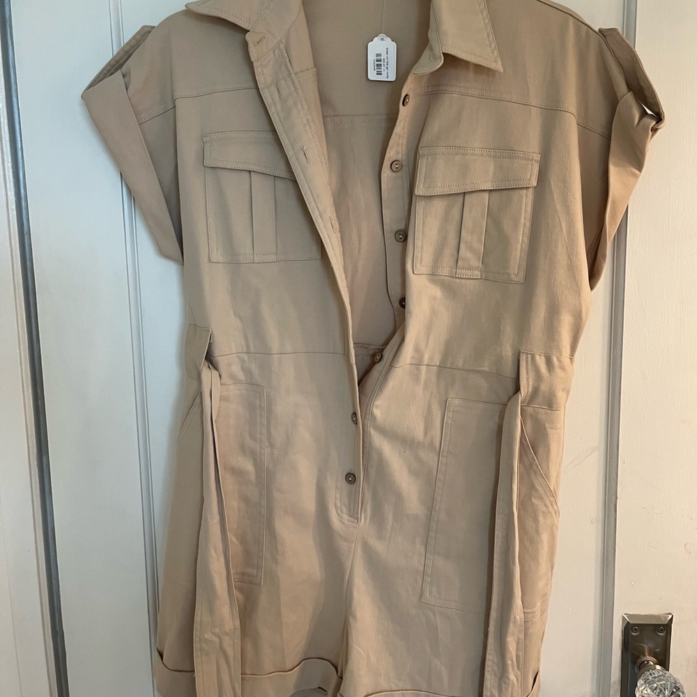 Beige romper with tie front at the waist. Stretchy soft but thick material.